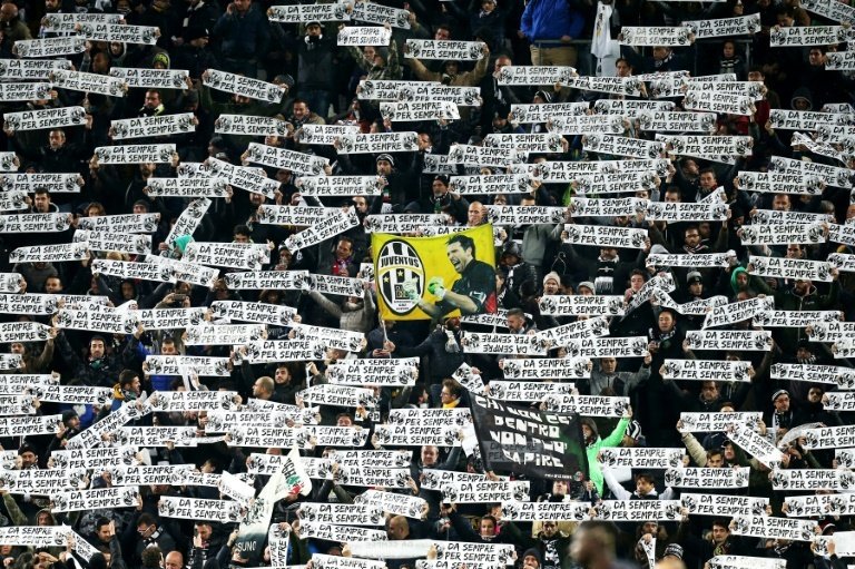 Juventus supporters hold banners reading Forever and ever during the Italian Serie A football match between Juventus and AC Milan on November 21, 2015 at the Juventus Stadium in Turin