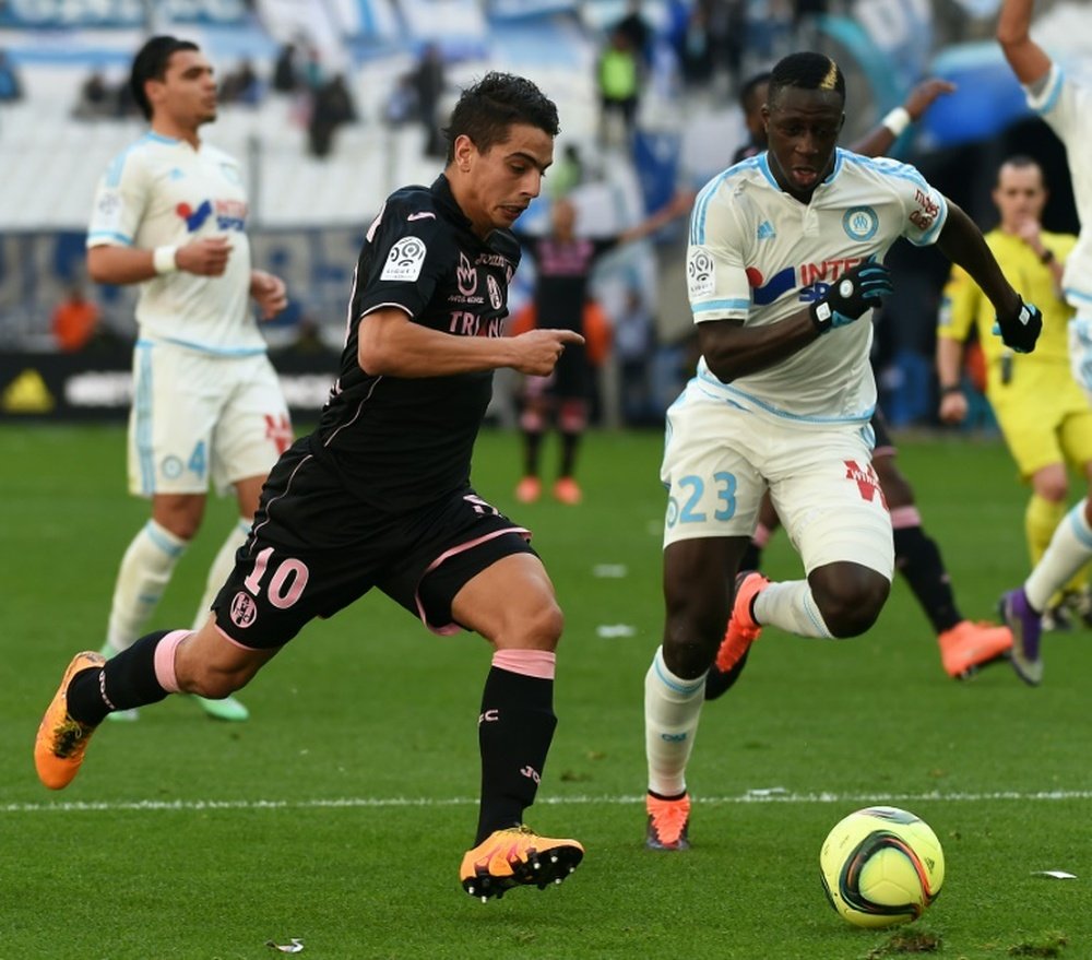 Toulouses French-Tunisian forward Wissam Ben Yedder (left) vies with Marseilles French defender Benjamin Mendy during their French L1 match at the Velodrome stadium in Marseille, southern France on March 6, 2016