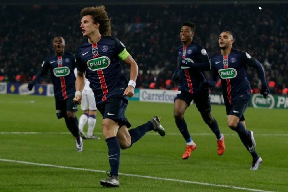 PSGs defender David Luiz (L) celebrates with teammates after scoring a goal during the French Cup match against Toulouse on January 19, 2016