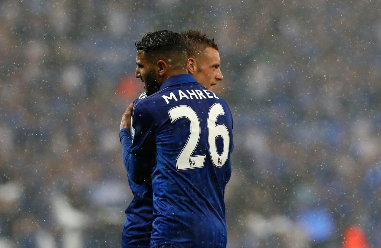 Leicester Citys midfielder Riyad Mahrez (L) embraces striker Jamie Vardy during an English Premier League football match on May 7, 2016