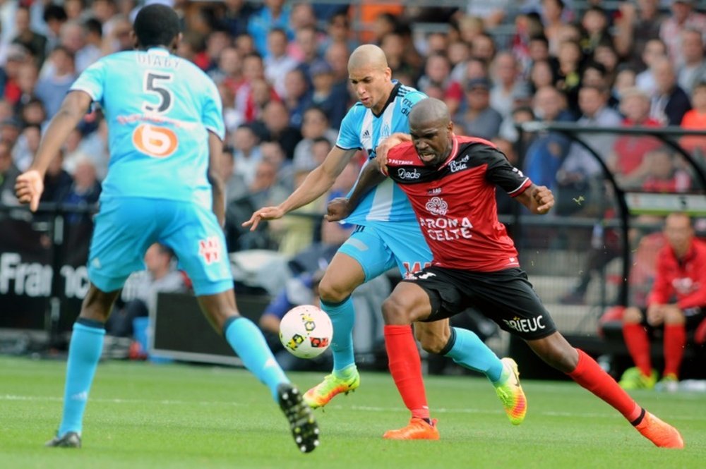 Guingamp forward Sloan Privat (R) is challenged by Marseille defender Matheus Doria Macedo. AFP