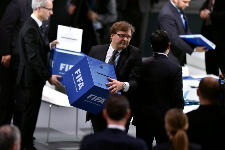 A delegate carries a ballot box before counting votes during the election of a new FIFA president at the extraordinary FIFA Congress at the headquarters of the worlds governing body of football in Zurich on February 26, 2016