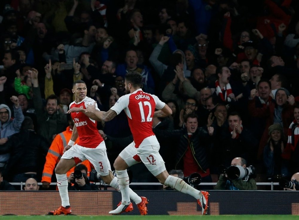 Arsenals defender Kieran Gibbs (L) celebrates with Olivier Giroud after scoring during an English Premier League football match at the Emirates Stadium in London on November 8, 2015