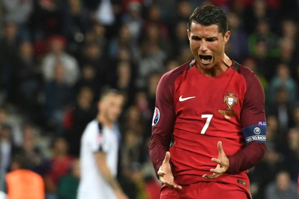 Portugals forward Cristiano Ronaldo reacts after missing an opportunity on goal during the Euro 2016 group F football match between Portugal and Austria at the Parc des Princes in Paris on June 18, 2016