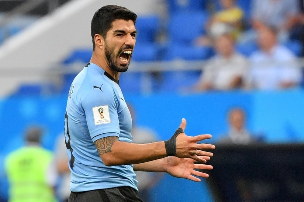 Suarez a toujours mal. AFP