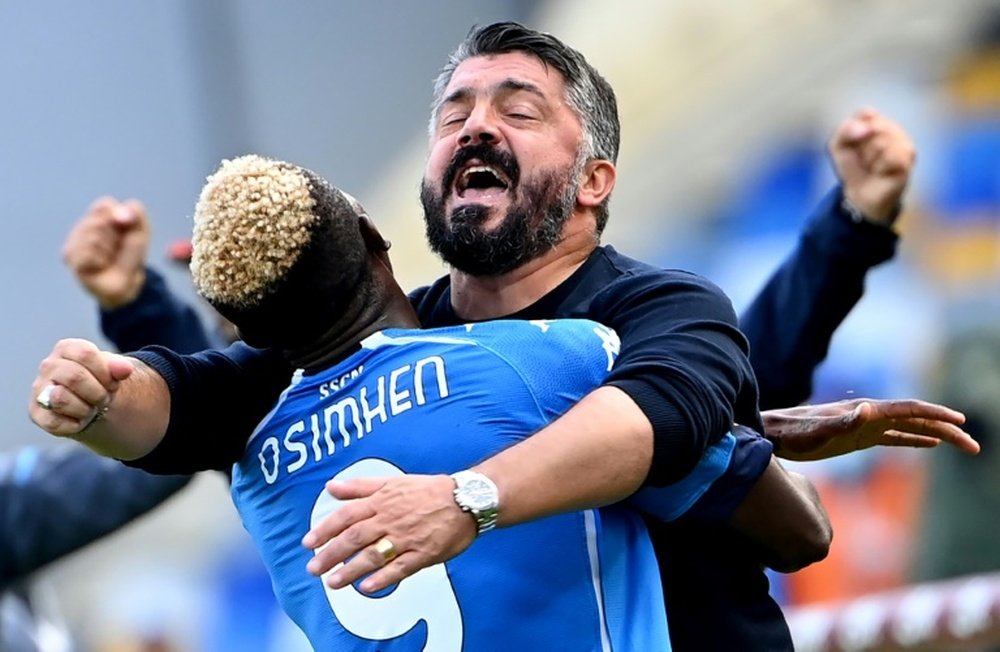 Nigerian forward Victor Osimhen celebrates with coach Gennaro Gattuso. AFP