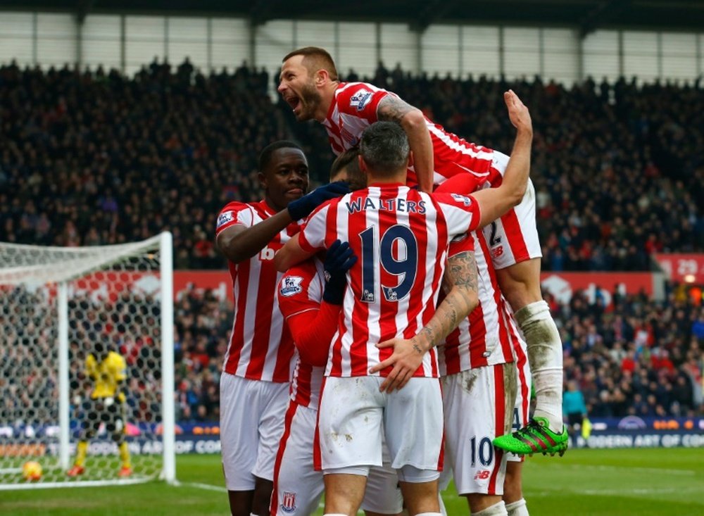 Stoke Citys striker Marko Arnautovic (C) celebrates with teammates after scoring his second goal during the English Premier League football match between Stoke City and Aston Villa in Stoke-on-Trent, England on February 27, 2016