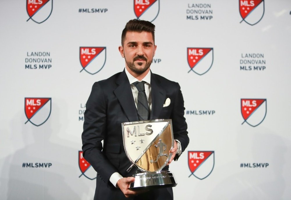 David Villa of New York City FC poses for a photo with the 2016 Landon Donovan MLS MVP trophy. AFP