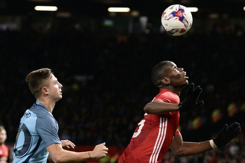 Maffeo keeps a close eye on Paul Pogba in the EFL Cup clash between Man City and Man Utd. AFP