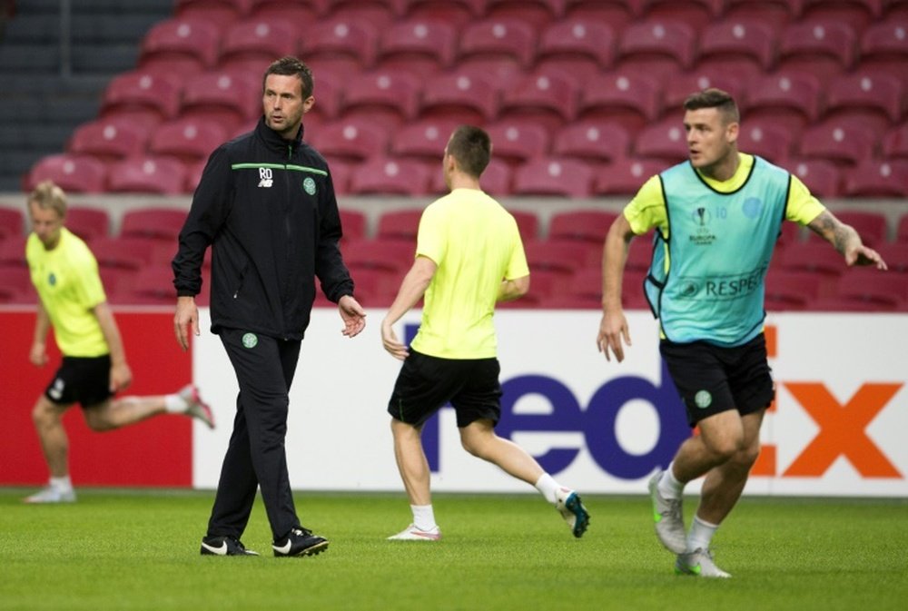 Celtic manager Ronny Deila (L) oversees his teams training session in Amsterdam, on September 16, 2015, on the eve of an UEFA Europa League match against Ajax