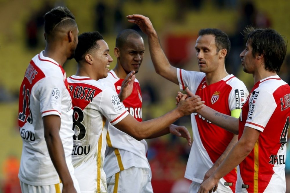 Monacos midfielder Helder Costa (2nd L) celebrates with teammates after scoring a goal during the French L1 football match Monaco vs Toulouse on January 24, 2016 at the Louis II Stadium in Monaco