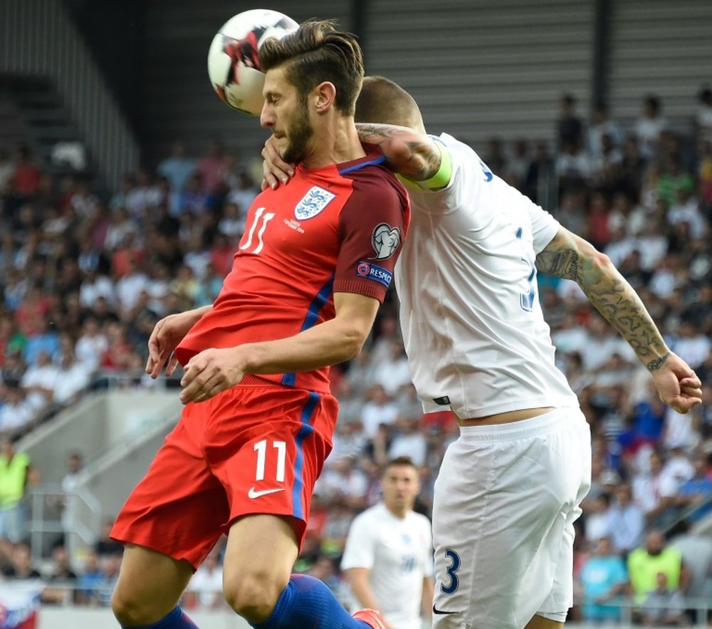Lallana (L) in action for England in their World Cup qualifier against Slovakia. AFP