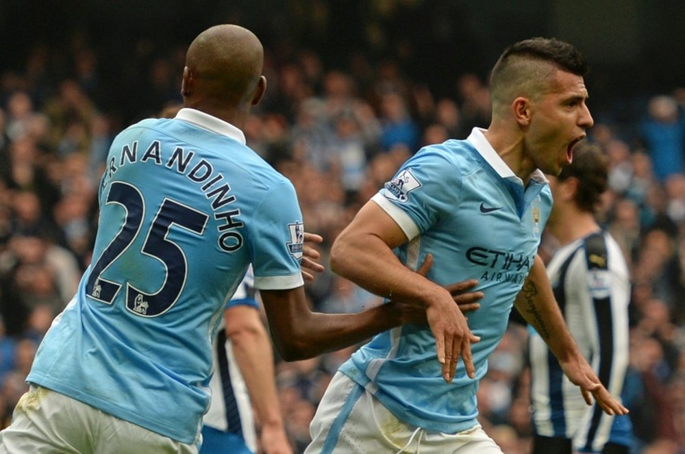 Manchester Citys Sergio Aguero (R) celebrates after scoring his first goal against Newcastle on October 3, 2015