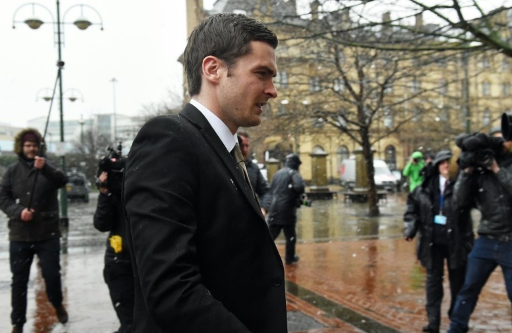 Former Sunderland footballer Adam Johnson (C) arrives at Bradford Crown Court in Bradford, northern England, on March 2, 2016