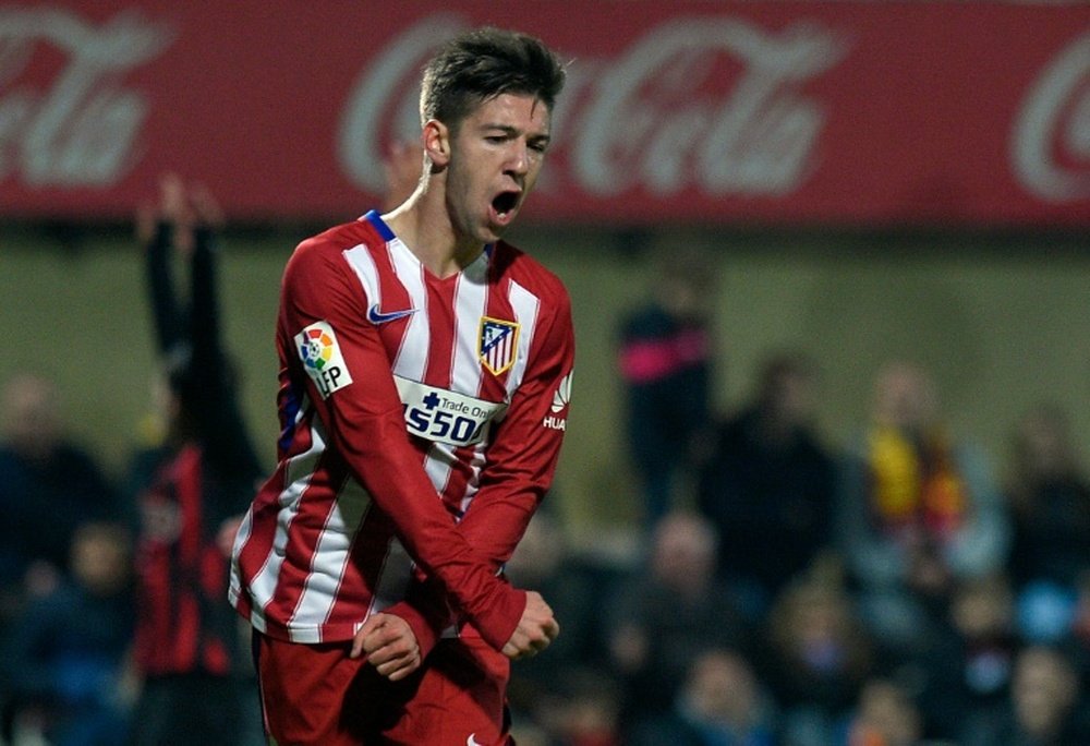 Atletico Madrids forward Luciano Vietto celebrates after scoring a goal during a Spanish Copa del Rey football match against Reus at the Estadi Municipal de Reus on December 1, 2015