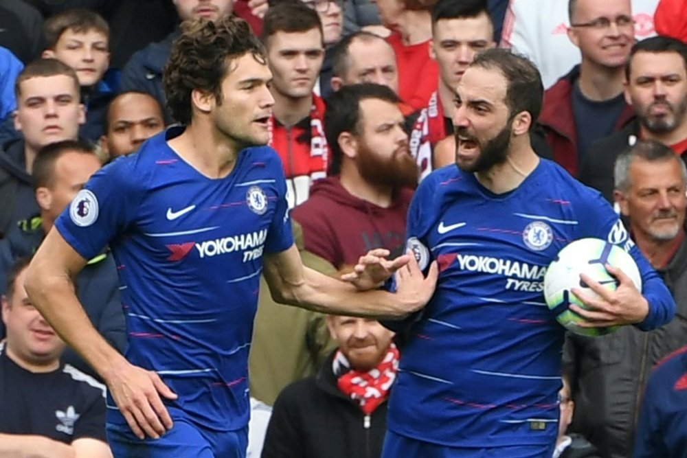 Higuain celebrating with Marcos Alonso. AFP