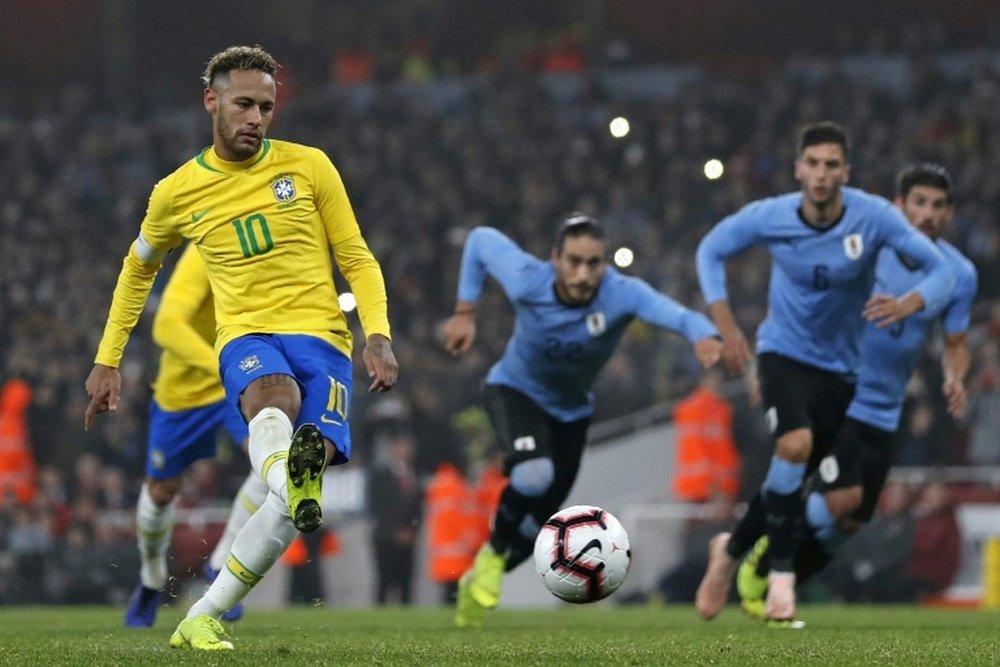 Brazil's Neymar scores the winner against Uruguay. AFP