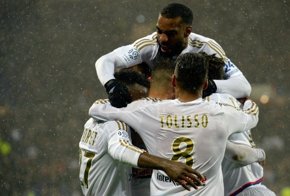 Lyons players celebrate after scoring a goal during the French L1 match vs Ajaccio in Decines-Charpieu, on April 30, 2016