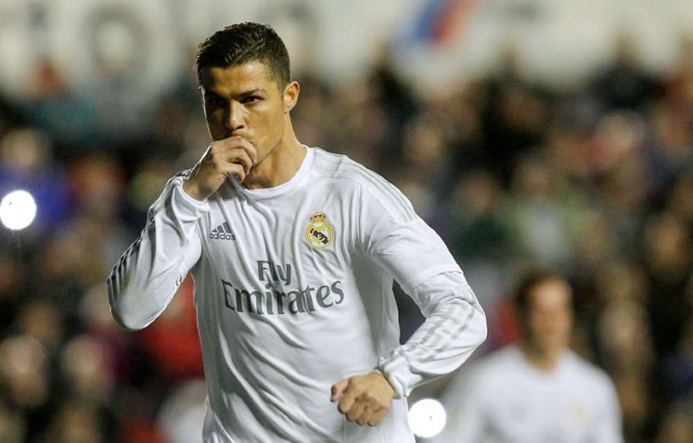 Real Madrids forward Cristiano Ronaldo celebrates a goal during the Spanish league football match Levante UD vs Real Madrid CF at the Ciutat de Valencia stadium in Valencia on March 2, 2016