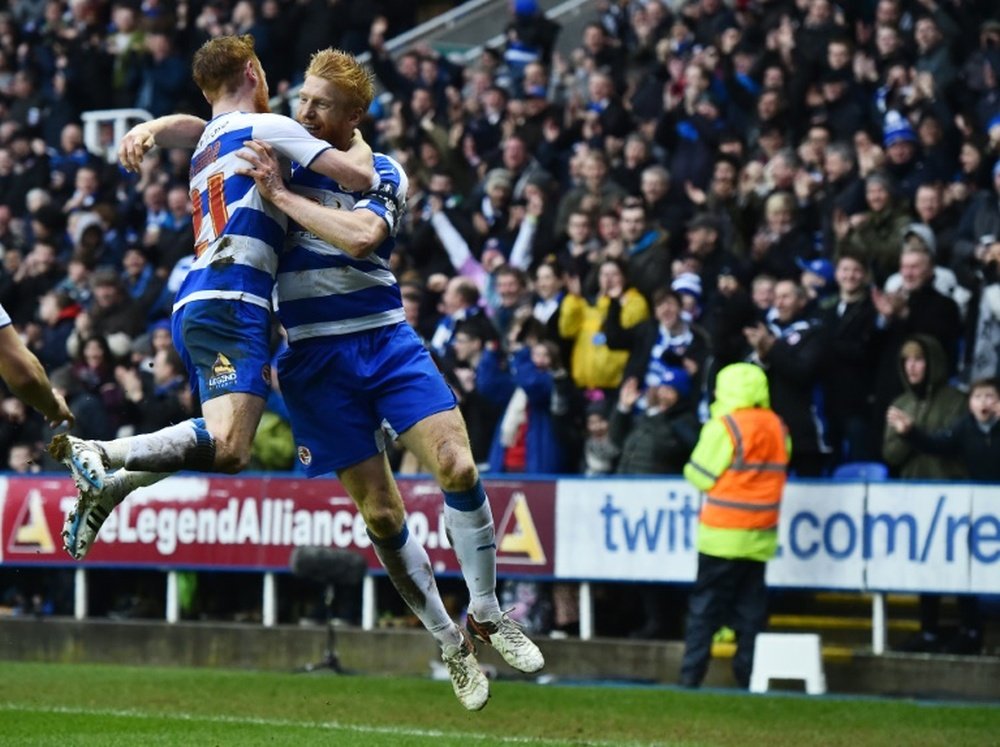 McShane (R) celebrates a goal with Reading team-mate Stephen Quinn. AFP