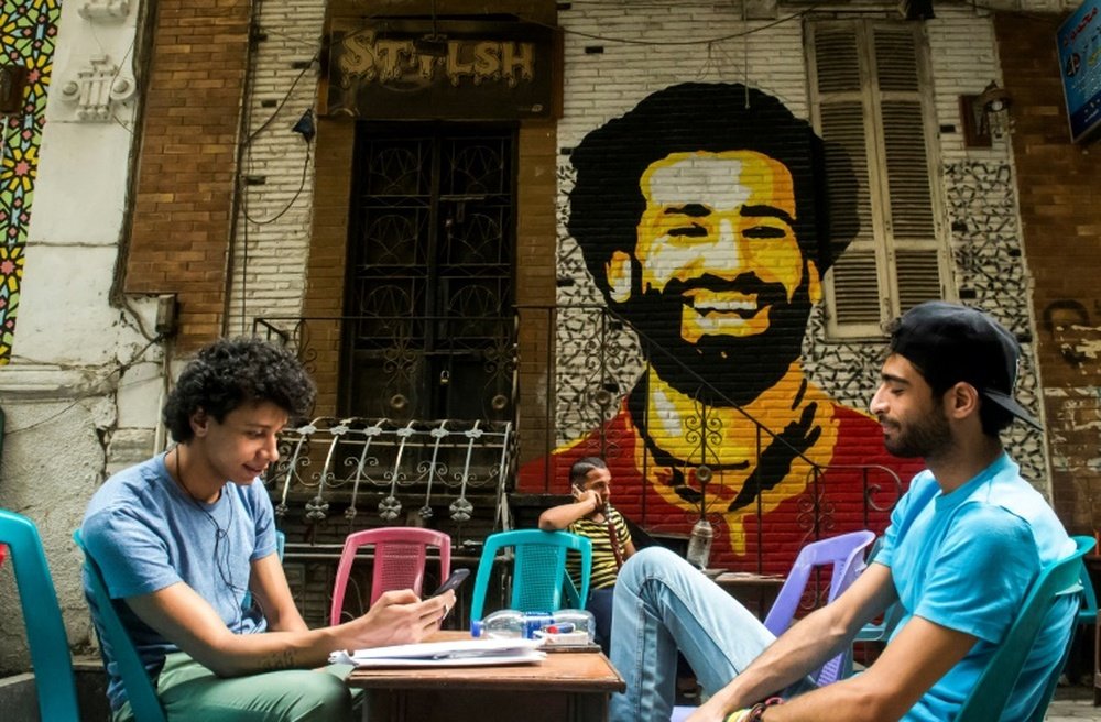 Salah's face can be seen dotted around Egypt. AFP