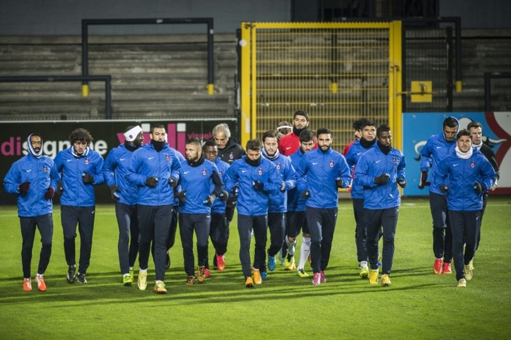 Trabzonspors players run during a training session in Lokeren, Belgium, in 2014