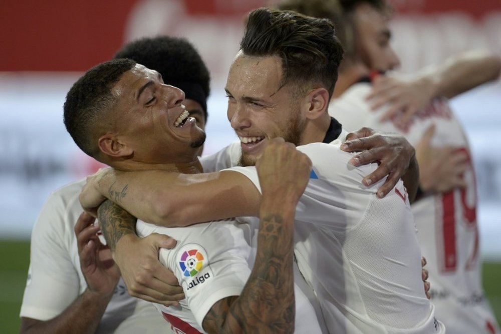 Ocampos (R) scored the first as Sevilla beat city rivals Betis 2-0. AFP