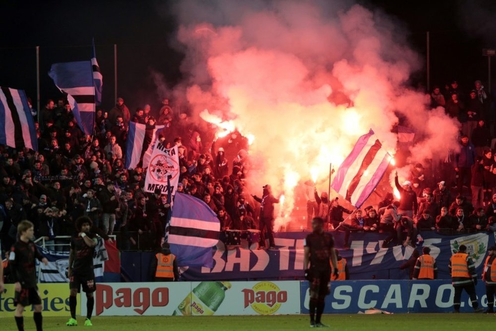Bastias supporters celebrate during the L1 football match between Bastia (SCB) and Nice (OGC) on January 20, 2017 at the Armand Cesari stadium in Bastia, on the French Mediterranean island of Corsica