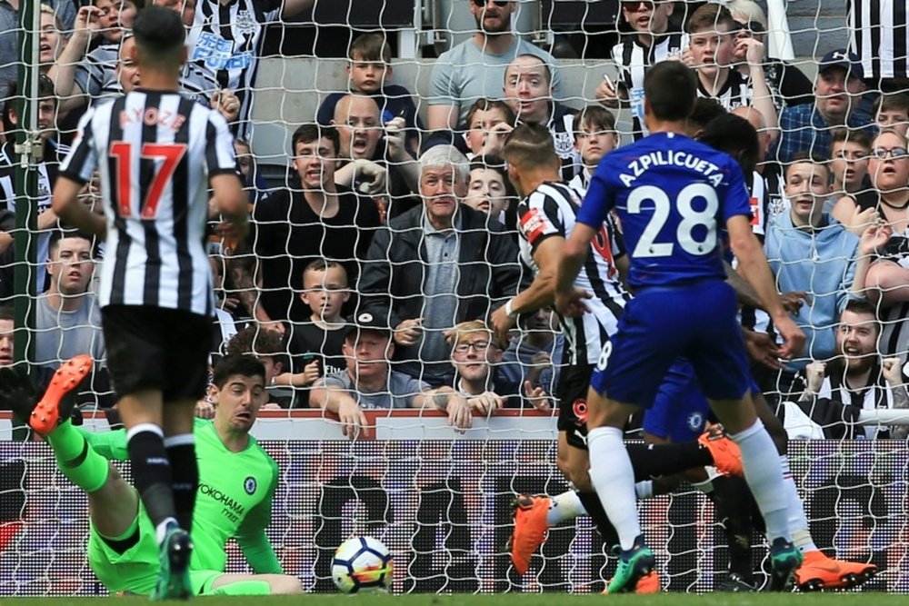 Gayle scores against Chelsea. AFP