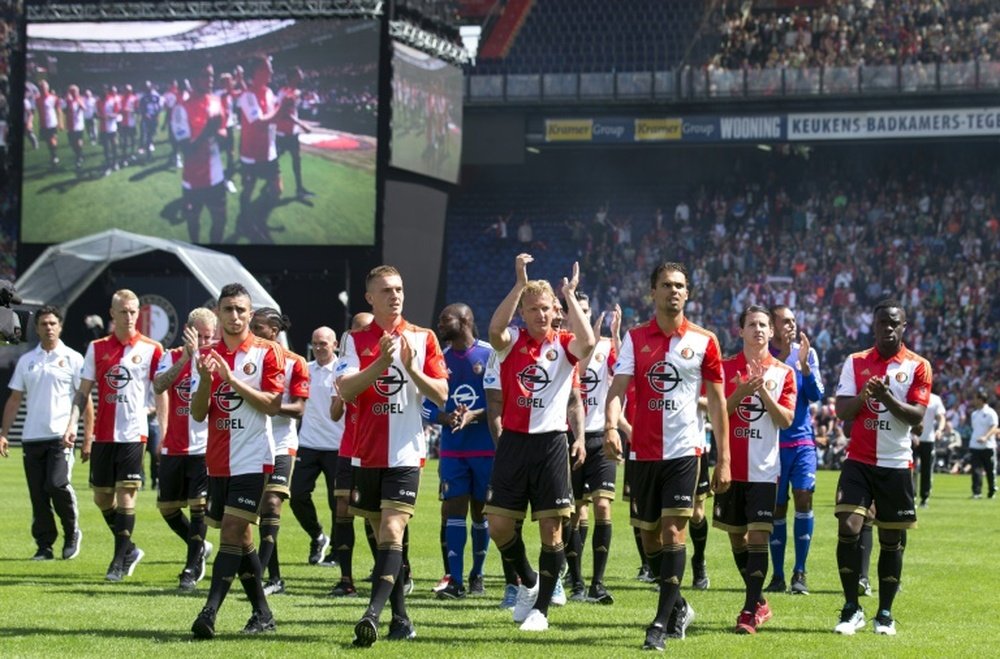 Feyenoord Rotterdams players walk on the pitch during the teams presentation to supporters on an Open Day at Feyenoord stadium in Rotterdam July 19, 2015
