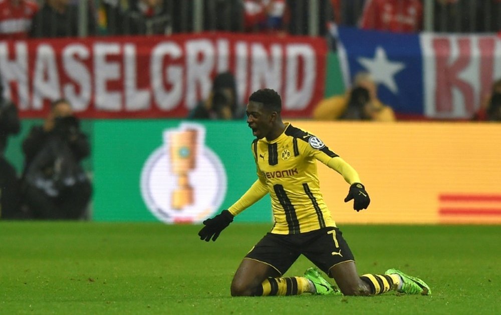 Dortmunds midfielder Ousmane Dembele celebrates after the second goal