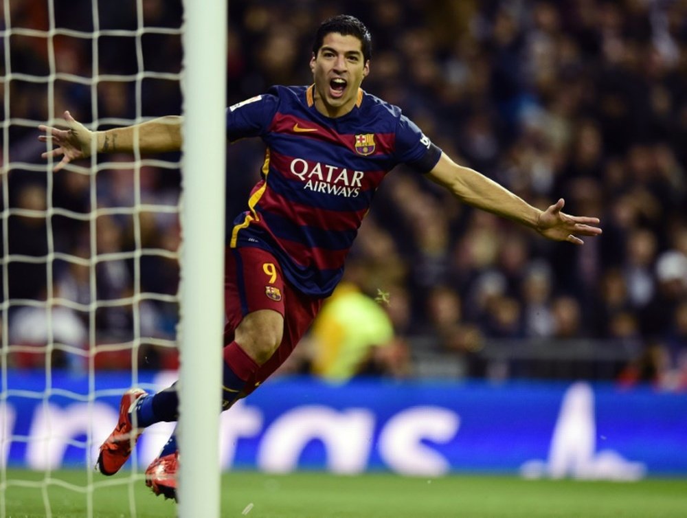 Barcelona forward Luis Suarez exults near the goal at the Santiago Bernabeu stadium in Madrid on November 21, 2015