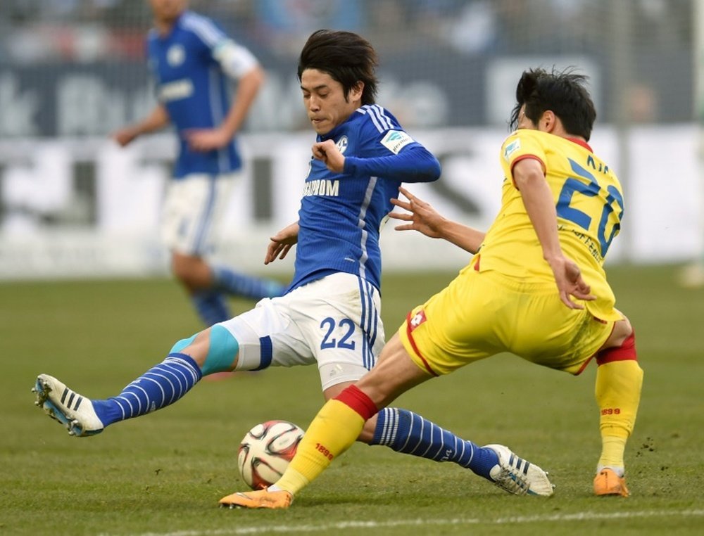 Japan pin-up Uchida returns home after Germany spell. AFP