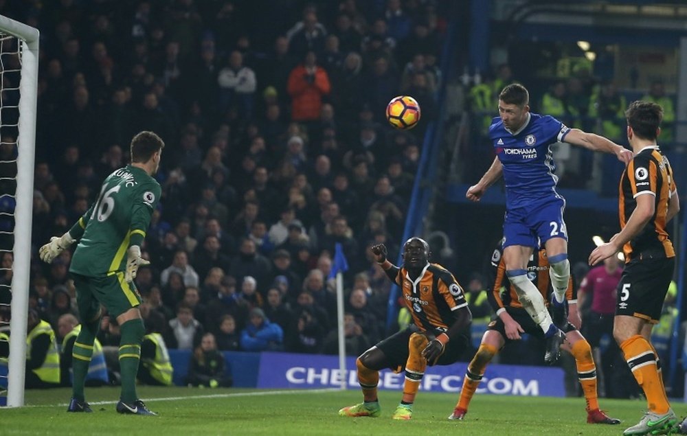 Chelseas Gary Cahill jumps to head teh ball past Hull Citys goalkeeper Eldin Jakupovic during the match at Stamford Bridge in London on January 22, 2017