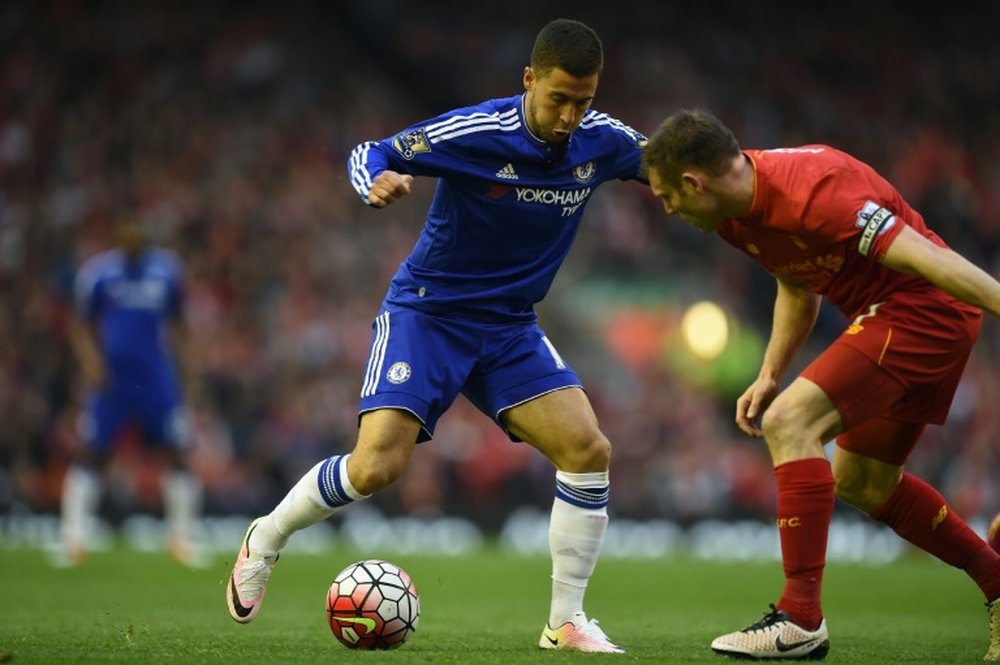 Chelsea's Eden Hazard vies with Liverpool's James Milner. AFP