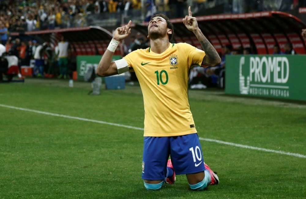 Brazils Neymar celebrates after scoring against Paraguay