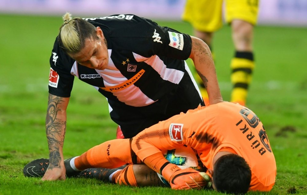 Pitch battle as Reus ends goal drought in Dortmund win