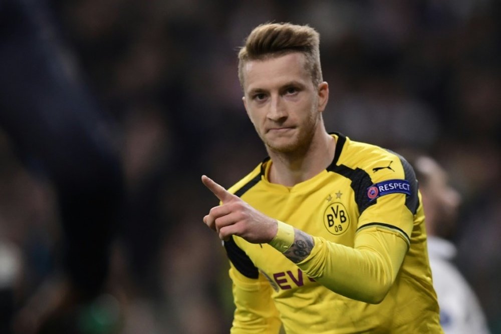 Dortmund's midfielder Marco Reus celebrates a goal during the UEFA Champions League. AFP