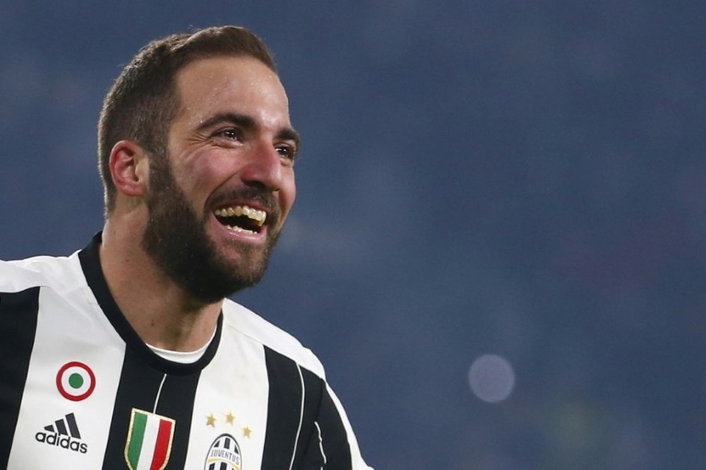 Juventus forward Gonzalo Higuain celebrates after scoring a goal on December 17, 2016