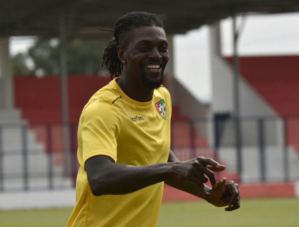 Emmanuel Adebayor (L) is pictured during a training session on January 18. AFP