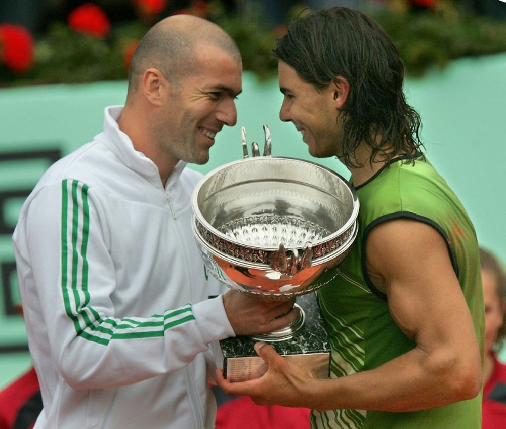 Rafa Nadal receiving the Roland Garros trophy from Zinedine Zidane back in 2005. AFP
