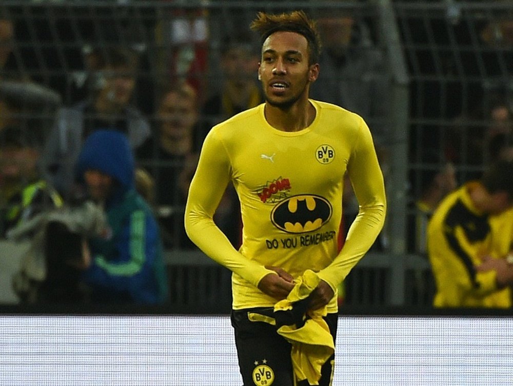Dortmunds striker Pierre-Emerick Aubameyang celebrates scoring by showing his Batman shirt during a German first division football Bundesliga against Schalke 04 on November 8, 2015