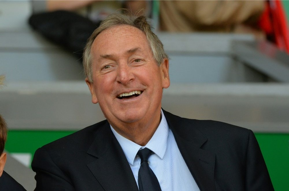 Liverpools French former manager Gerard Houllier smiles before an English Premier League football match on October 4, 2014