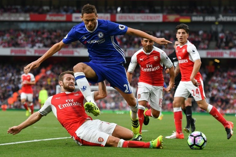 Mustafi challenges Chelsea's Nemanja Matic. AFP