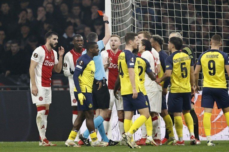 10-man Ajax survive scare to reach Europa League last 16