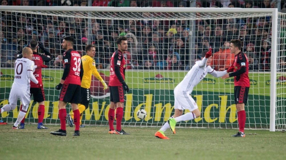 Bayern's Robert Lewandowski celebrates after scoring against SC Freiburg. AFP