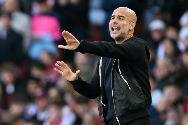 Guardiola was left pleased after their Carabao Cup win at Huddersfield Town. AFP