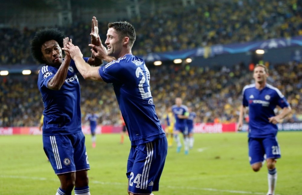 Chelseas defender Gary Cahill (R) celebrates with his Brazilian teammate Willian after scoring a goal during their UEFA champions league match between Maccabi Tel Aviv and Chelsea FC, in Haifa on November 24, 2015
