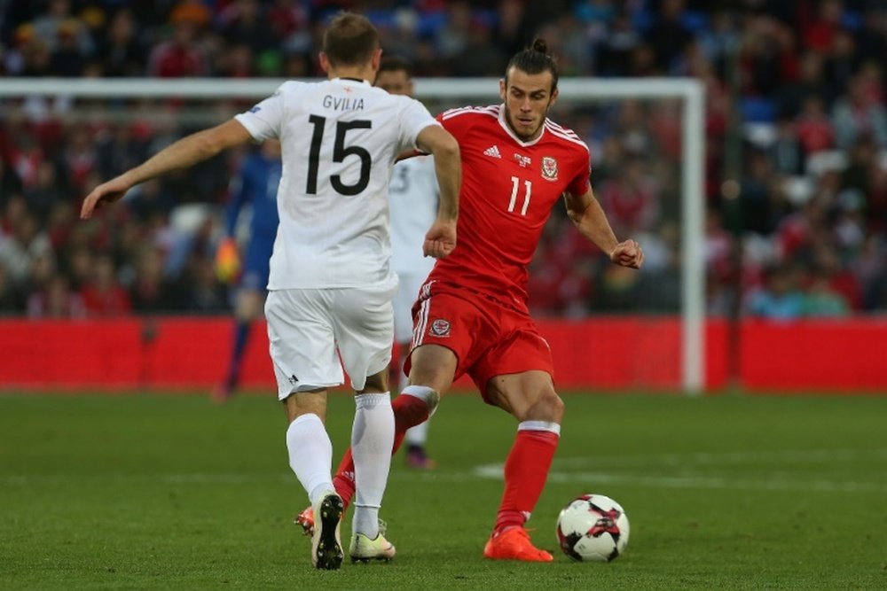 Gareth Bale dribbles round Georgias Valeri Gvilia during the World Cup qualifier in Cardiff on October 9, 2016