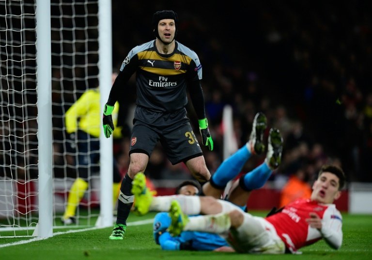 Petr Cech watches as Arsenals Hector Bellerin clears the ball from his goal mouth during the Champions League defeat against Barcelona at The Emirates on February 23, 2016